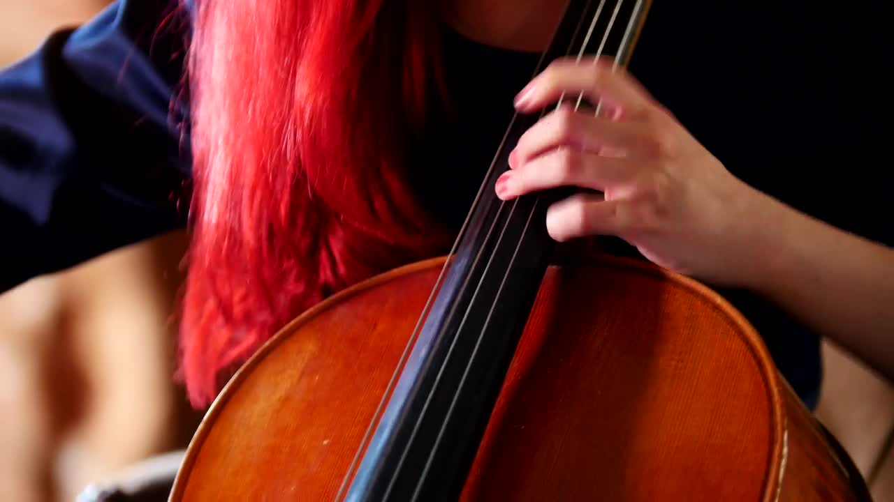 Download Video Stock Red Haired Woman Playing The Cello Live Wallpaper Free