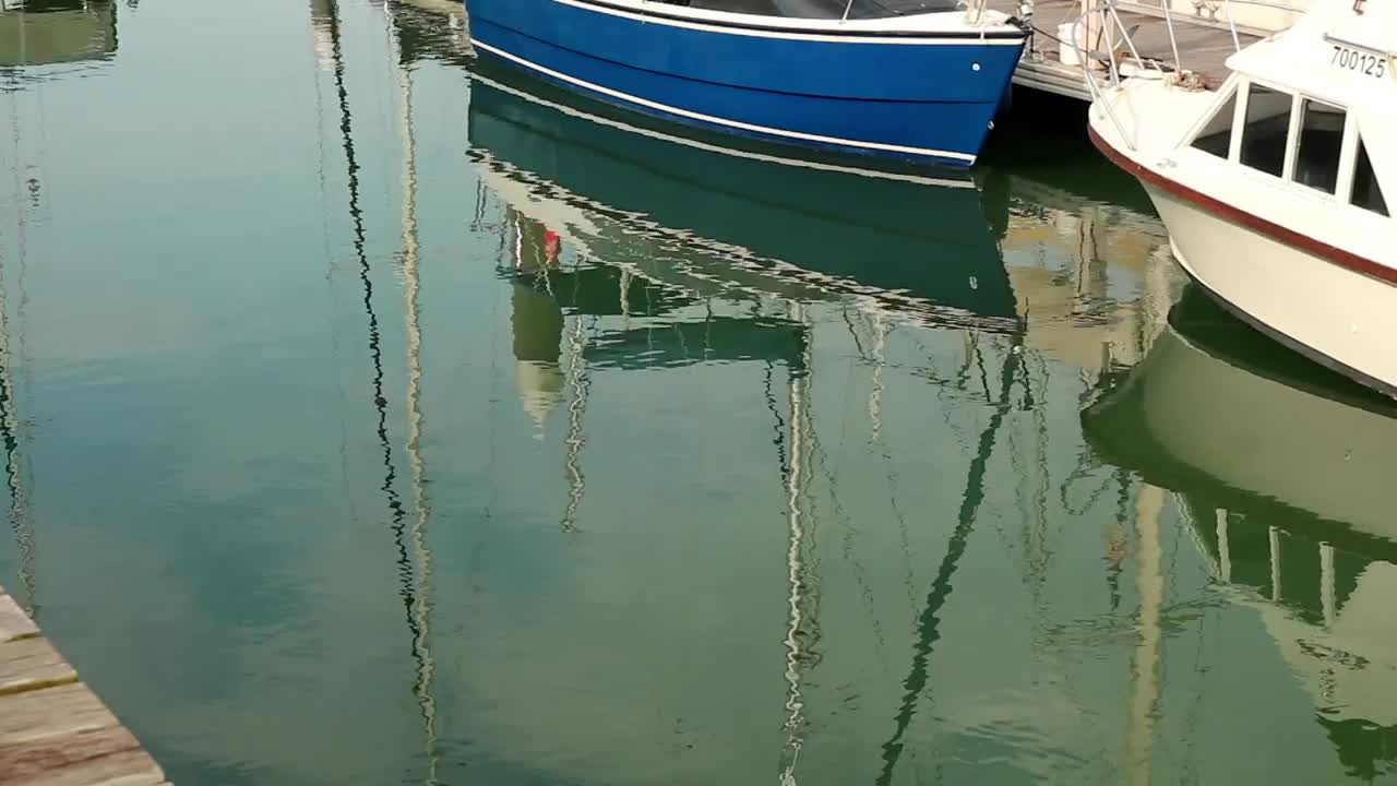 Download Free Stock Video Reflections Of Boats In A Harbor Live Wallpaper