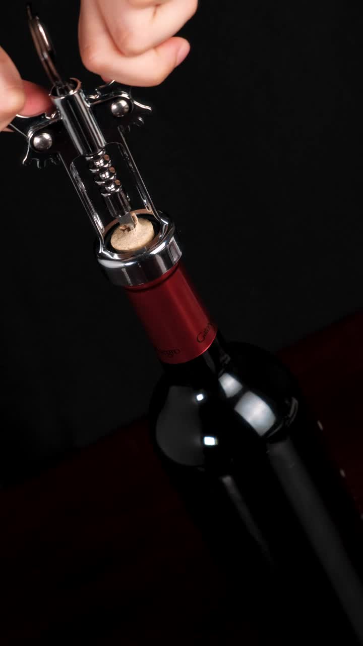 Download Free Stock Video Removing The Cork From A Wine Bottle With A Corkscrew Live Wallpaper