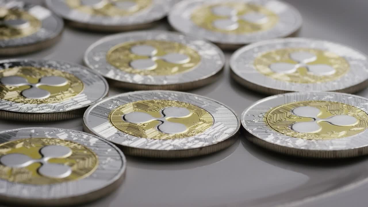 Download Free Stock Video Ripple Bitcoins Coins Rotating On A Surface Live Wallpaper