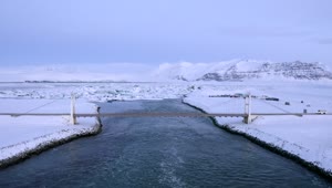Download Free Stock Video River With A Bridge In A Snowy Area Live Wallpaper