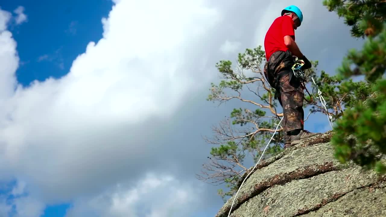 Download Free Stock Video Rock Climber Descending On Rock Live Wallpaper