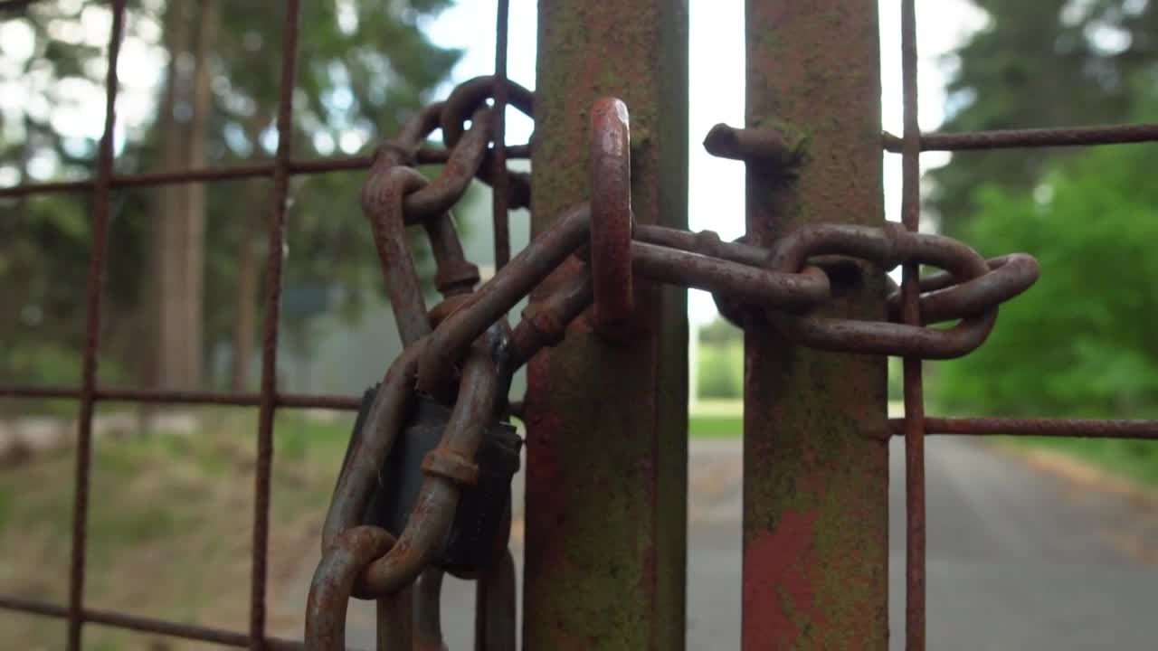 Download Free Stock Video Rusty Fence With A Chain Of A Property In Nature Live Wallpaper