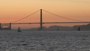 Download Free Stock Video Sailboats In Front Of The Golden Gate Bridge During Sunset Live Wallpaper