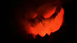 Download Free Stock Video Scary Halloween Pumpkin Lit Up In The Dark Live Wallpaper