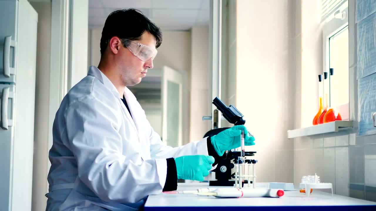 Download Free Stock Video Scientist In A Laboratory Preparing A Sample Live Wallpaper