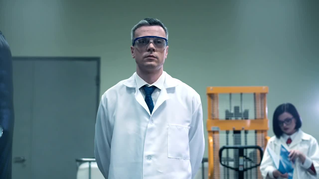 Download Free Stock Video Scientist Walking In The Lab Live Wallpaper