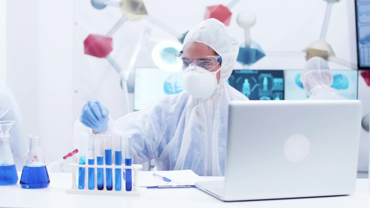 Download Free Stock Video Scientist Working With Vials Live Wallpaper