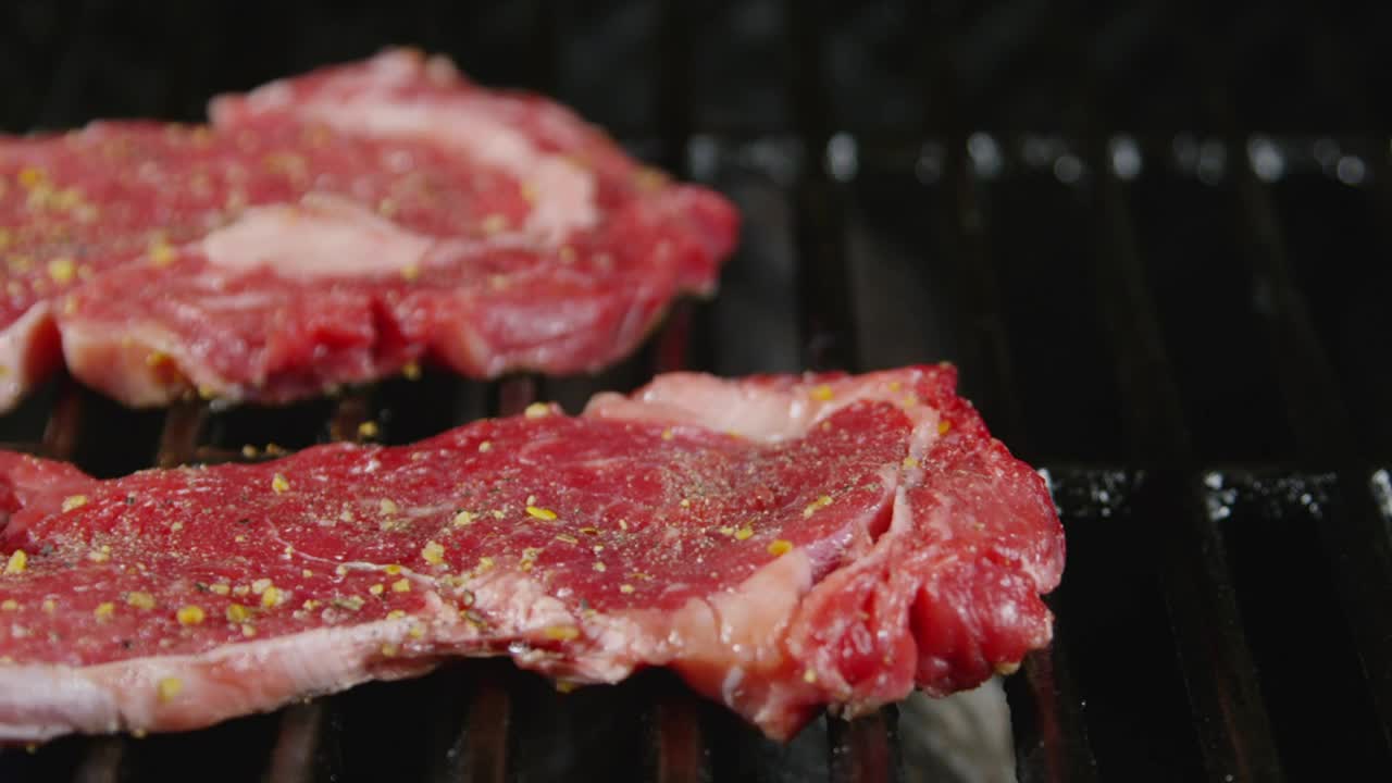 Download Free Stock Video Seasoned Steak On The Grill Live Wallpaper