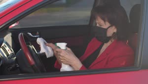 Download Free Stock Video Senior Woman Disinfecting The Steering Wheel Live Wallpaper