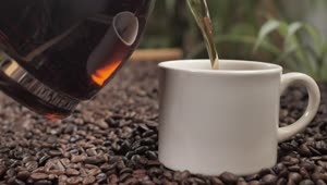 Download Free Stock Video Serving Coffee In A Cup On Coffee Beans Live Wallpaper