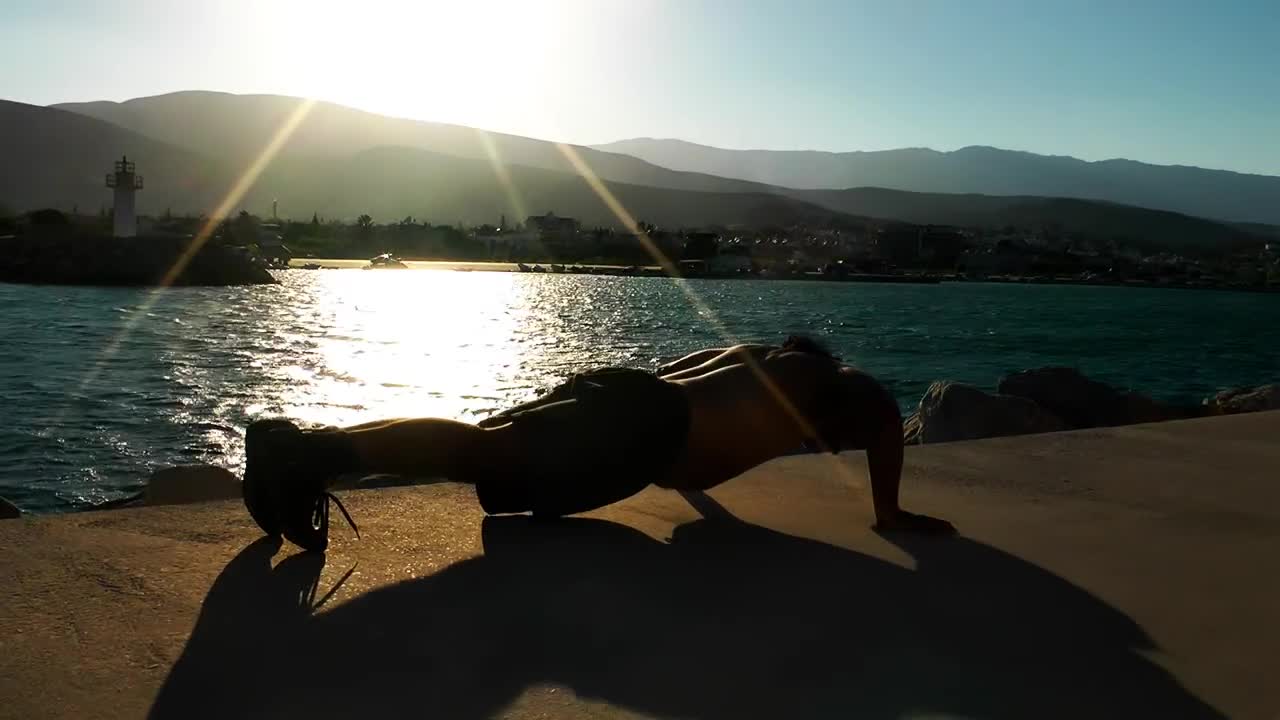 Download Free Stock Video Shirtless Man Doing Push Ups On The Boardwalk Live Wallpaper