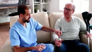 Download Free Stock Video Sick Man Chats With Nurse Giving Him Medication Live Wallpaper