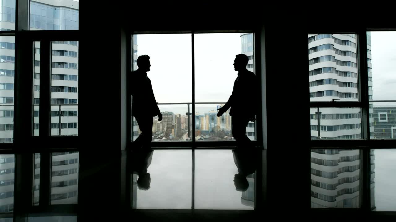 Download Free Stock Video Silhouette Of Business Handshake In Skyscraper Live Wallpaper