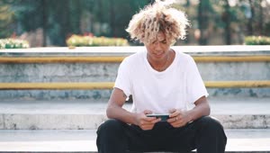 Download Free Video Stock Skater Texting And Looking At The Camera Live Wallpaper