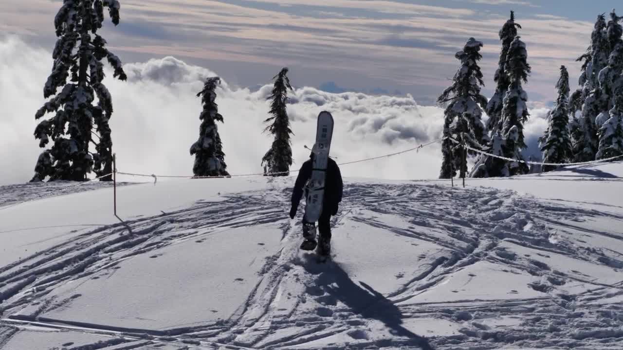 Download Free Video Stock Skier At The Peak Of A Snowy Mountain Live Wallpaper