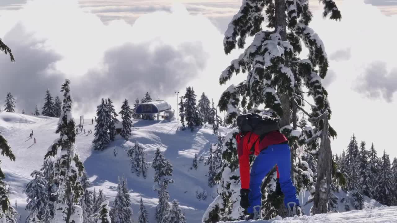 Download Free Video Stock Skier Fitting A Boot On Top Of A Mountain Live Wallpaper