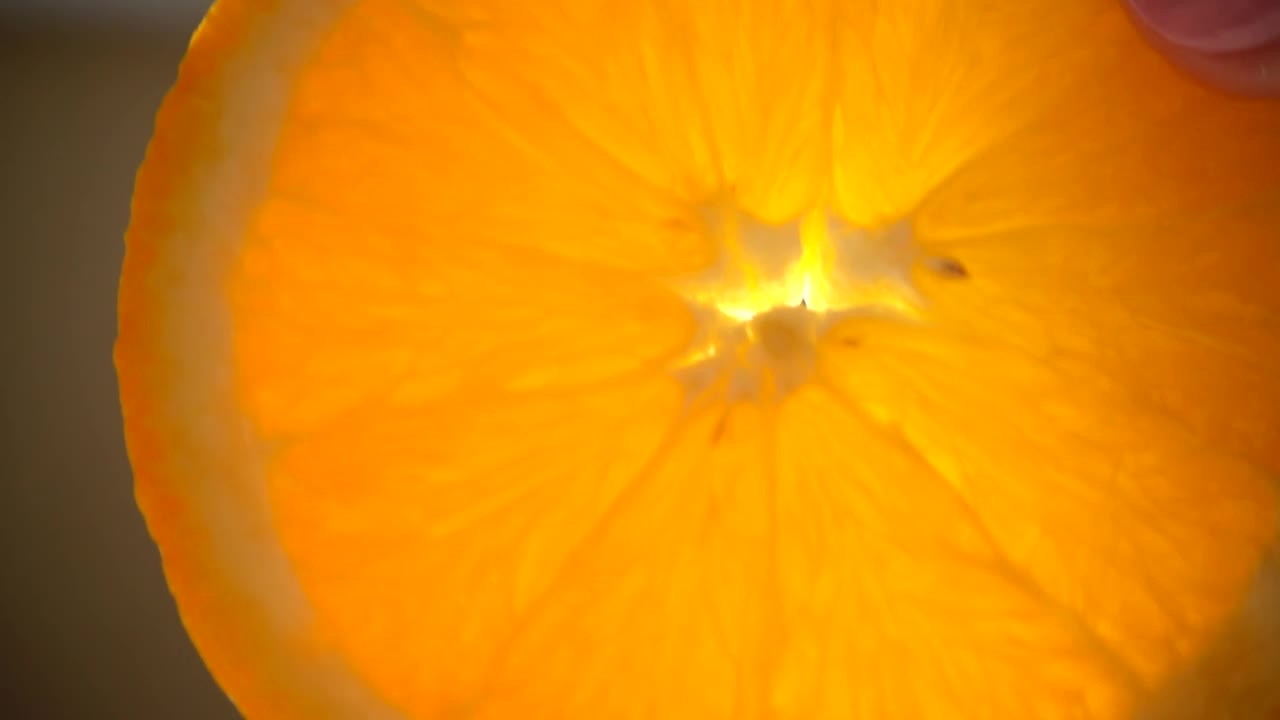 Download Free Video Stock Slice Of Wet Orange In A Very Close Shot Live Wallpaper