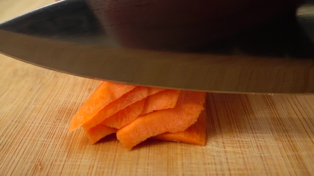 Download Free Video Stock Slicing Carrot On A Board Live Wallpaper