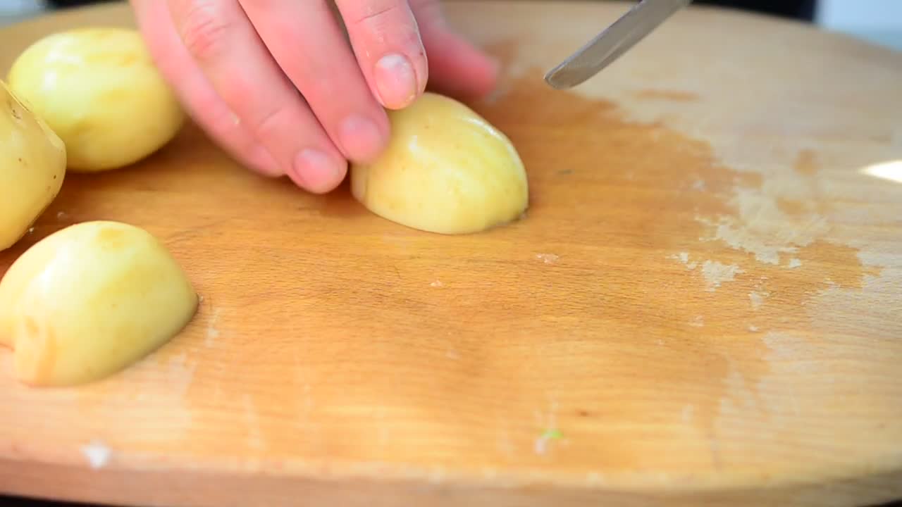 Download Free Video Stock Slicing Raw Potatoes On A Table Live Wallpaper