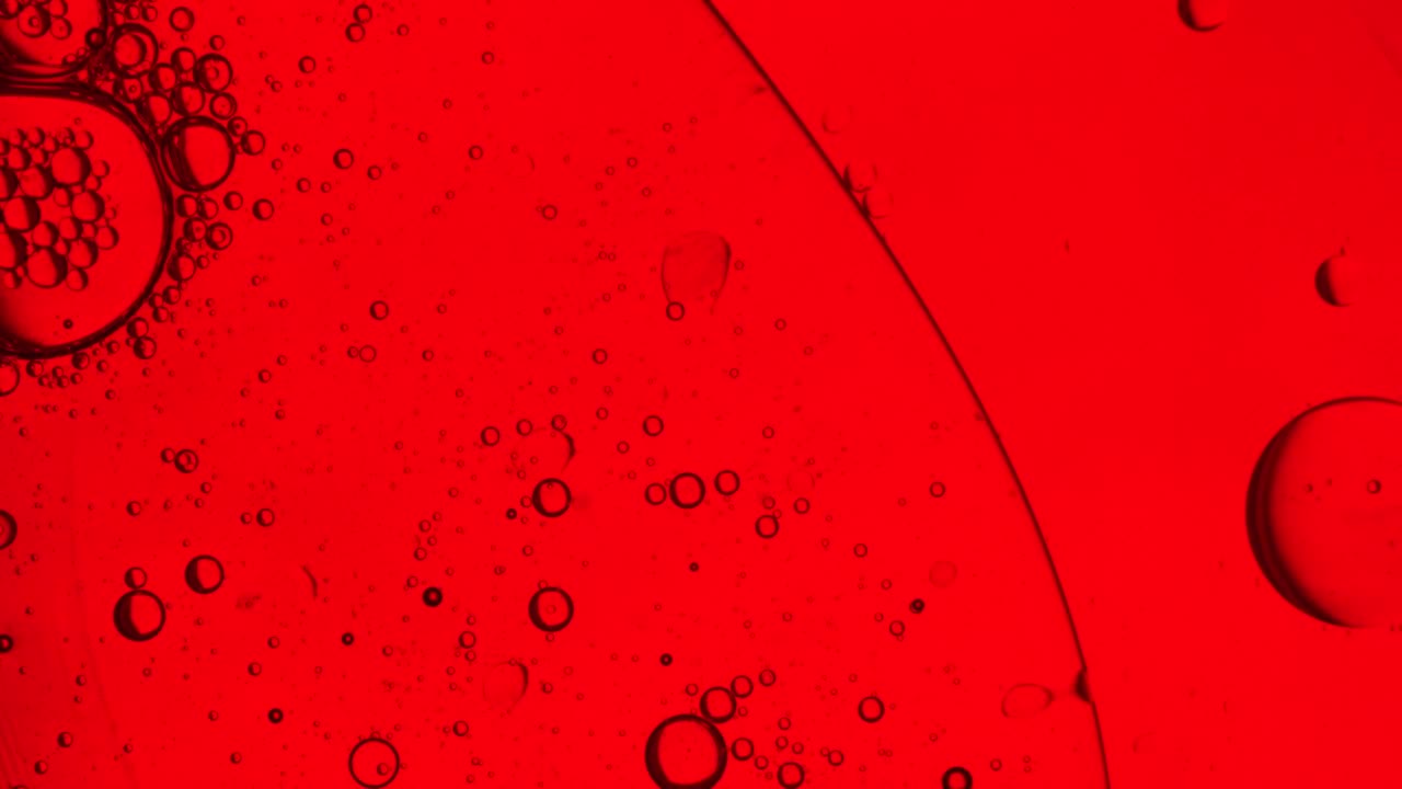 Download Free Video Stock Small Bubbles In A Liquid On A Red Background Live Wallpaper