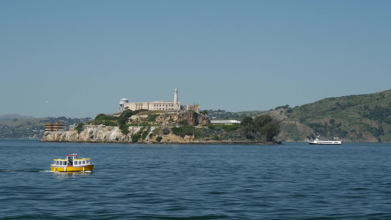 Download Free Video Stock Small Cruise Ship Passing By Alcatraz Island Live Wallpaper