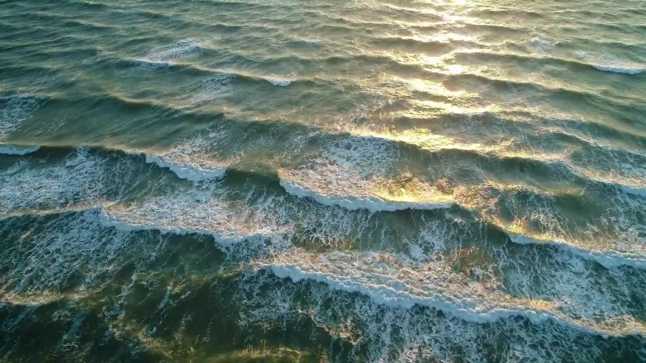 Download Free Video Stock Small Frequent Waves Reaching The Beach High View Live Wallpaper