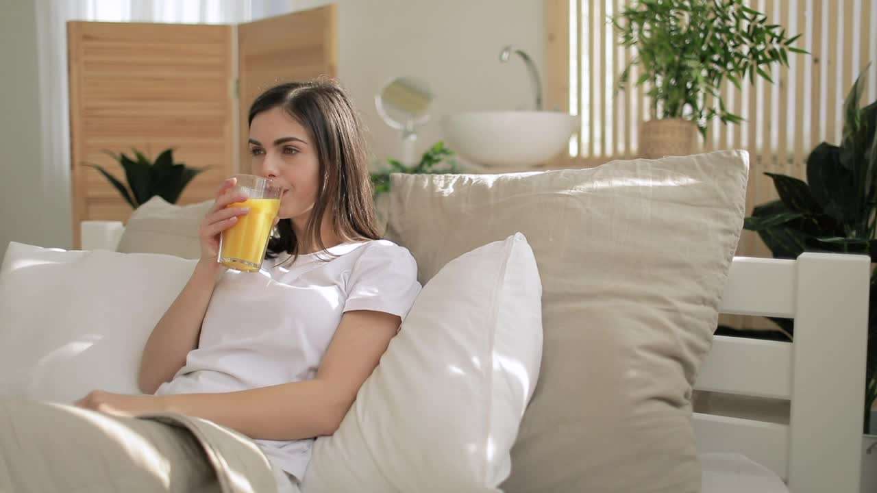 Download Free Video Stock Smiling Woman Drinking Orange Juice Live Wallpaper