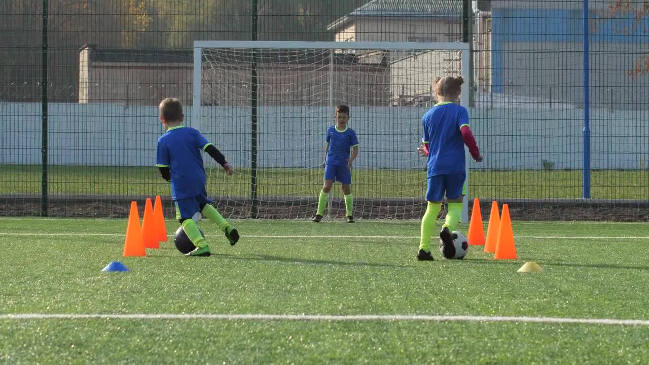 Download Free Video Stock Soccer Players Training Against A Goalie Live Wallpaper