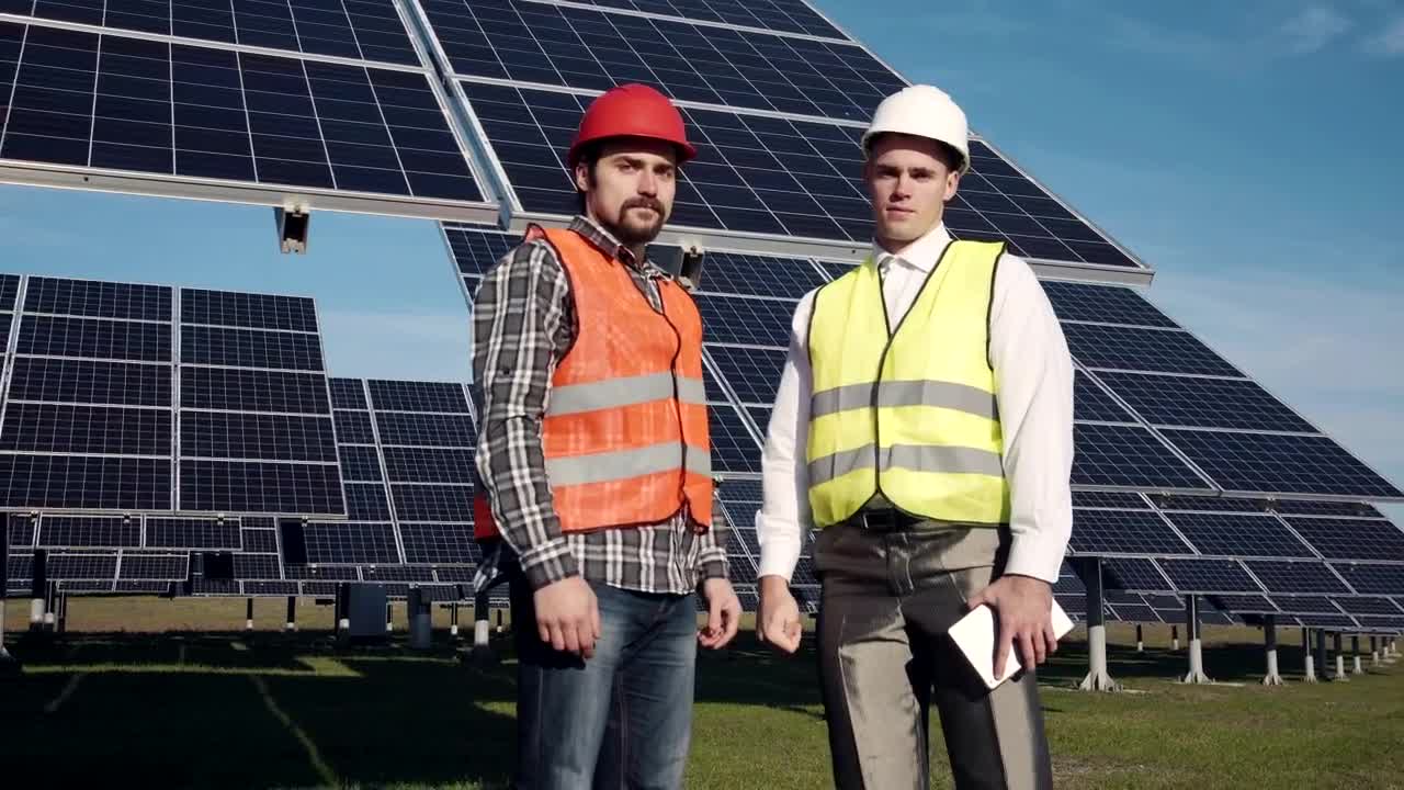 Download Free Video Stock Solar Power Engineers Posing To Camera Live Wallpaper