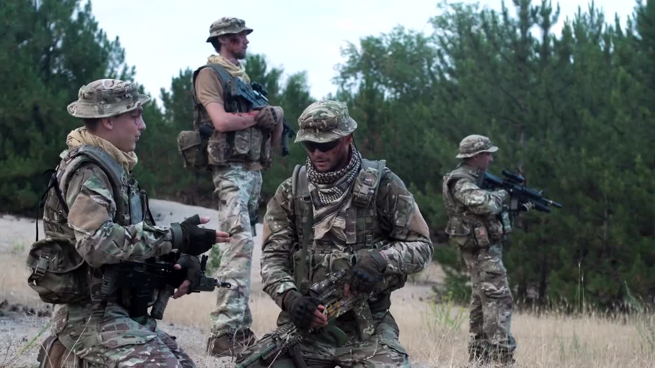 Download Free Video Stock Soldiers Checking The Strategy On The Map Live Wallpaper