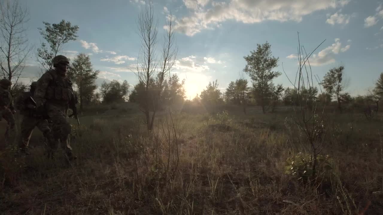 Download Free Video Stock Soldiers Walking Through The Field Live Wallpaper