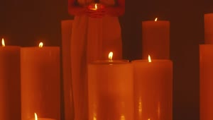 Download Free Video Stock Spiritual Woman Surrounded By Lots Of Candles Live Wallpaper