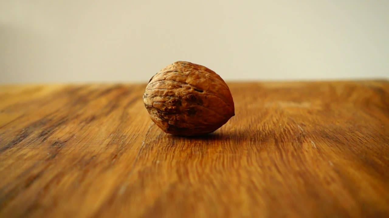 Download Free Video Stock Splitting A Walnut With A Hammer Live Wallpaper