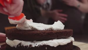 Download Free Video Stock Spreading Cream On A Chocolate Cake Live Wallpaper