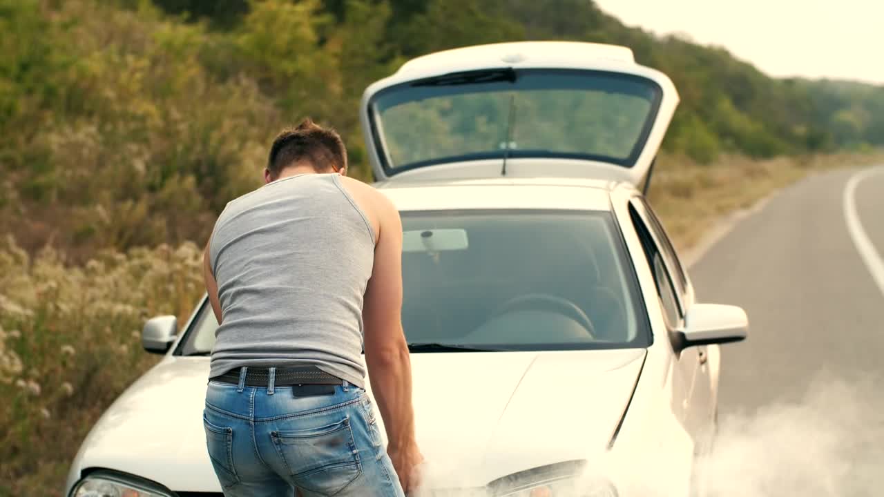 Download Free Video Stock Stranded On The Road With A Smoking Broken Car Live Wallpaper