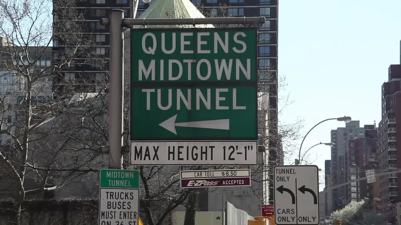 Download Free Video Stock Street Signs Leading To A Tunnel Live Wallpaper