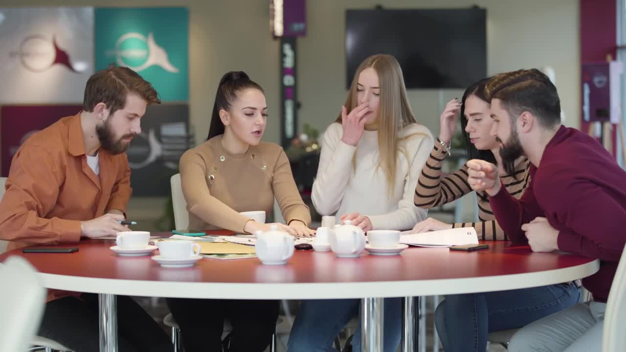 Download Free Video Stock Students In A Cafeteria Discussing An Assignment Live Wallpaper