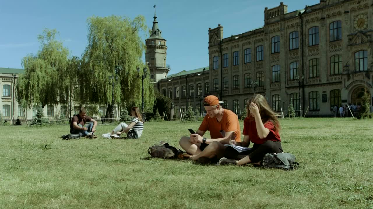 Download Free Video Stock Students Resting In A University Garden Live Wallpaper