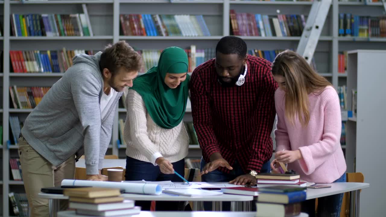 Download Free Video Stock Students Standing In The Library Live Wallpaper