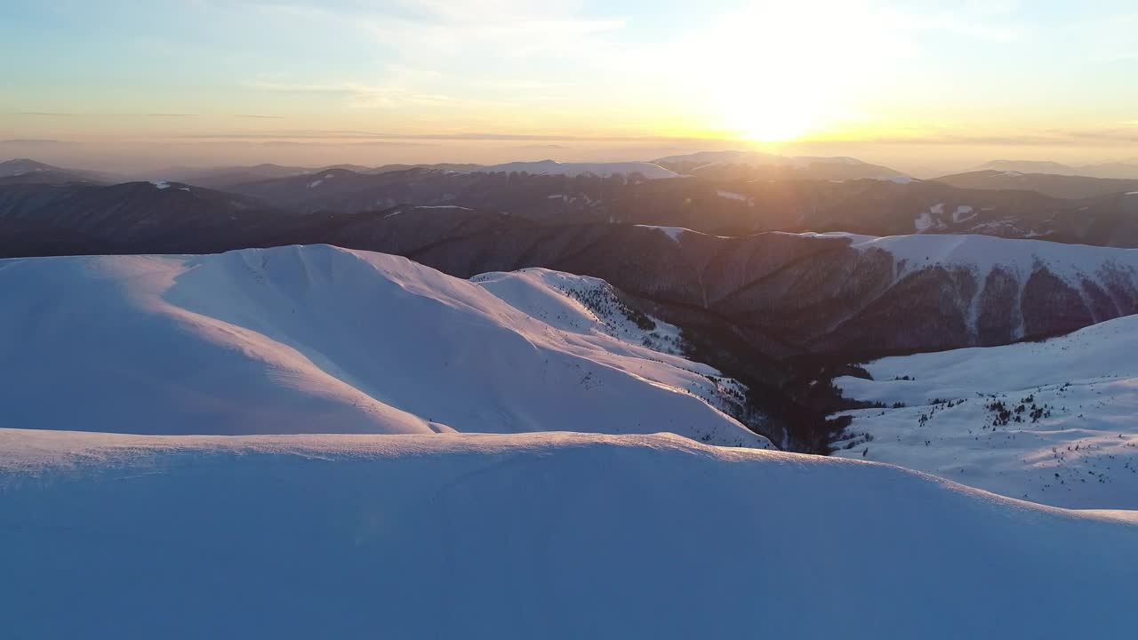 Download Free Video Stock sunrise on the skyline of a winter mountain range Live Wallpaper