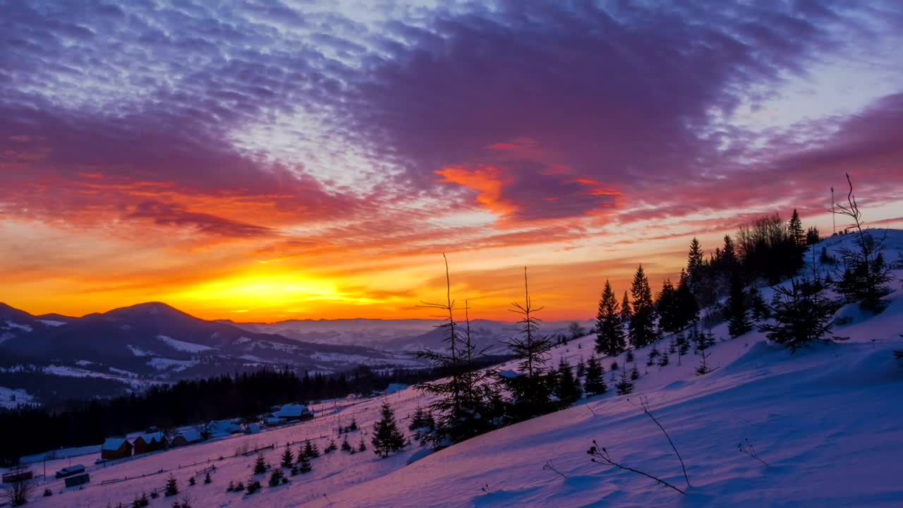 Download Free Video Stock sunrise over a winter mountain Live Wallpaper