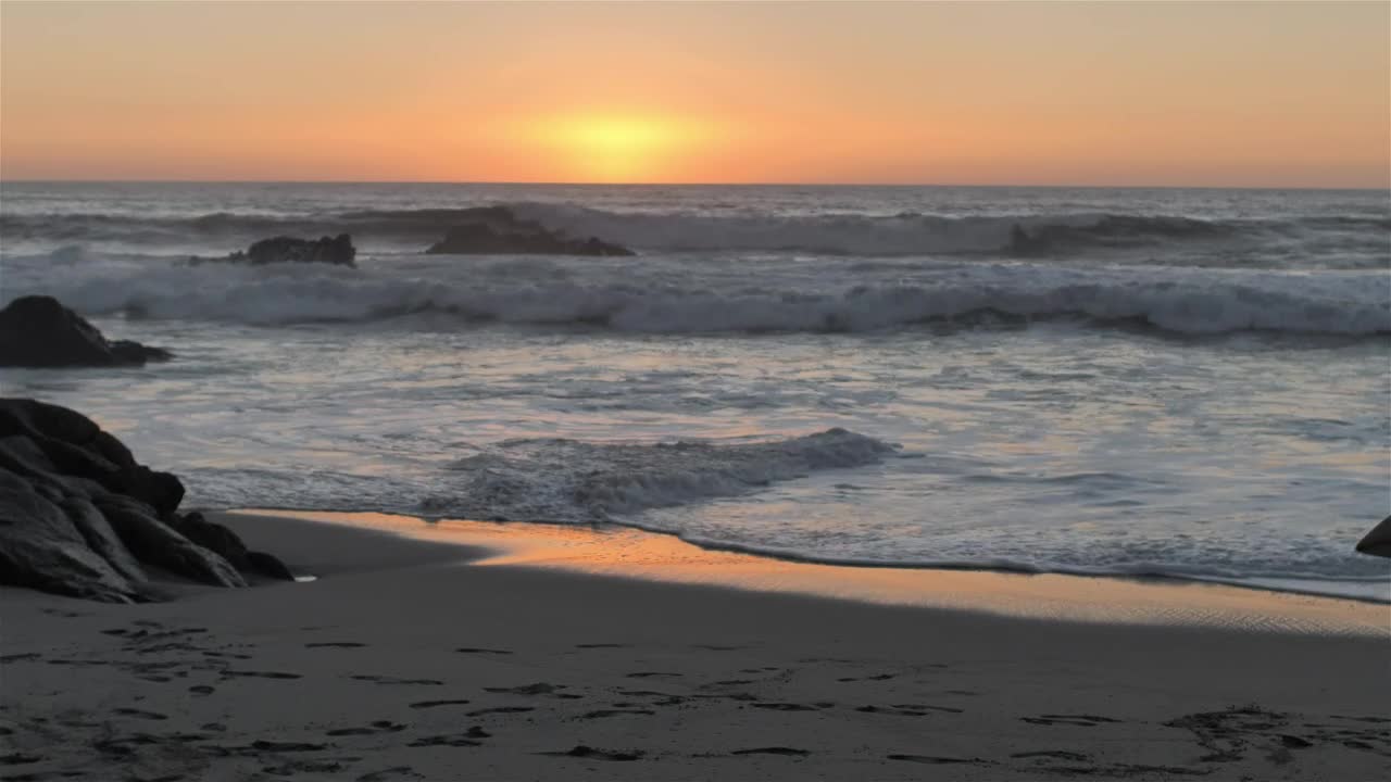 Download Free Video Stock surfer walking on the beach with the sun on the Live Wallpaper