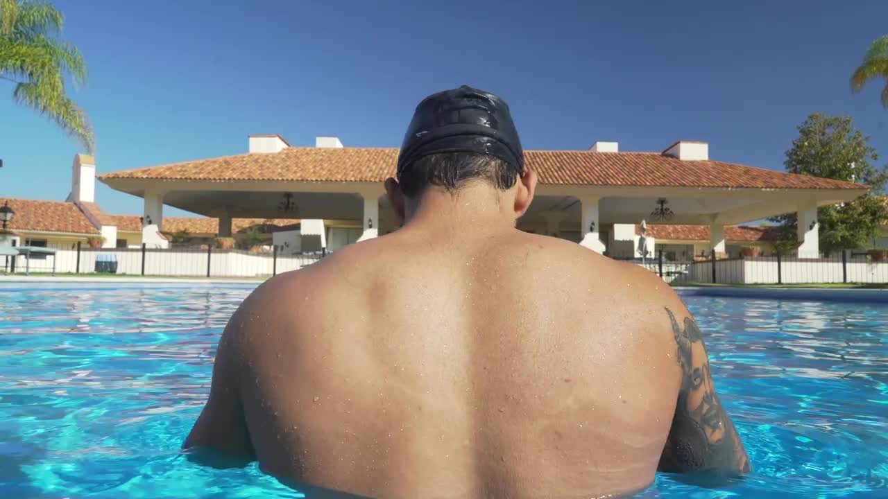 Download Free Video Stock swimmer in the pool seen from behind Live Wallpaper