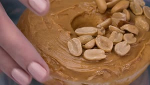 Download Free Video Stock taking a peanut butter donut from a plate Live Wallpaper