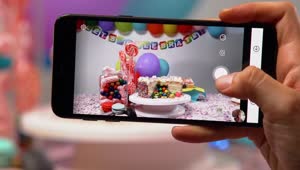Download Free Video Stock taking a picture of a birthday table with a smartphone Live Wallpaper