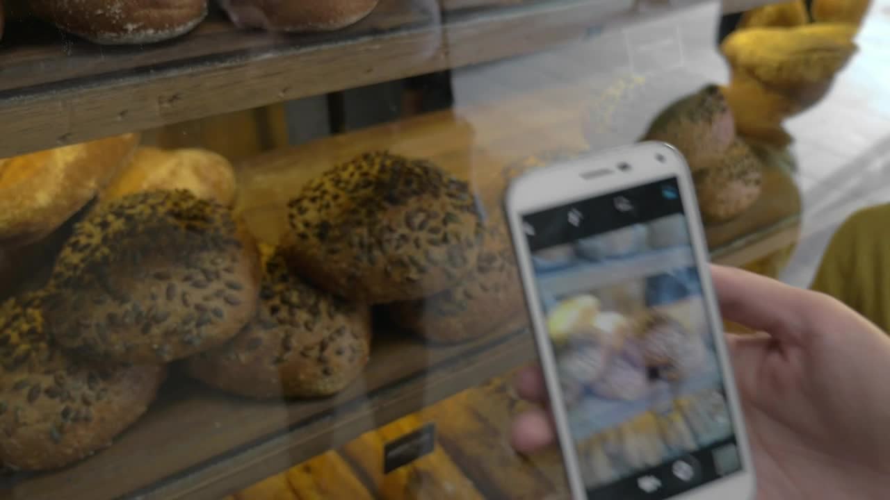 Download Free Video Stock taking photos of a bakery Live Wallpaper