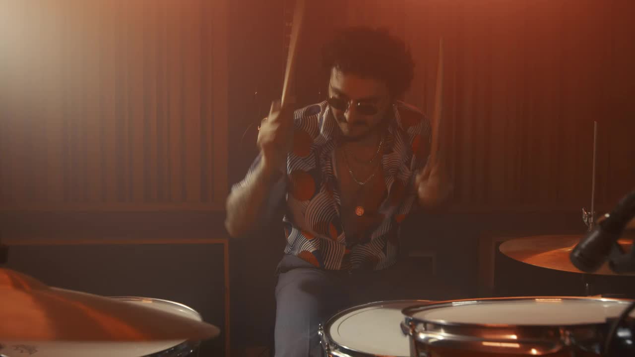 Download Free Video Stock talented drummer playing in a recording booth Live Wallpaper