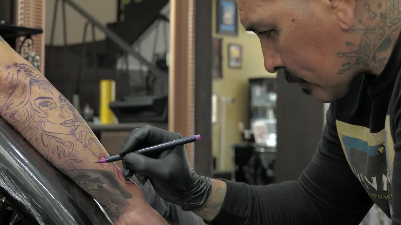 Download Free Video Stock tattooed tattooist working Live Wallpaper