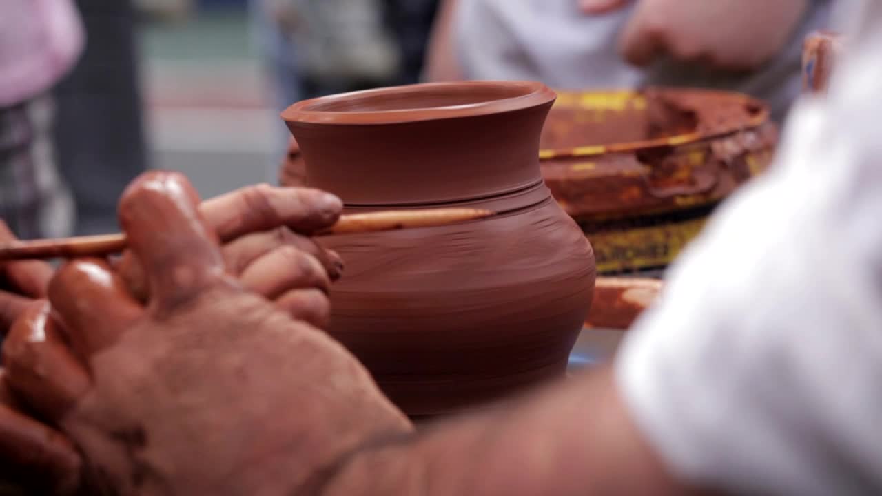 Download Free Video Stock teaching a child to craft clay pots Live Wallpaper